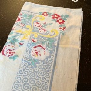 1950s tablecloth has a couple of small stains on it